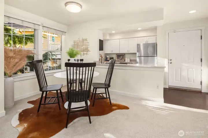 Dining room with W-facing windows bringing in tons of natural light.
