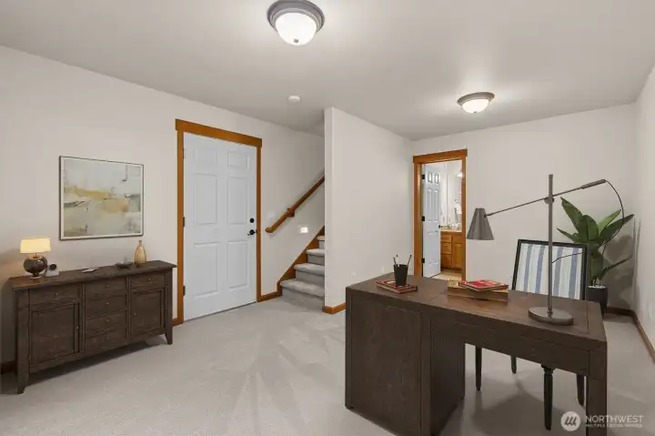Basement could be used as a home office, room is virtually staged.