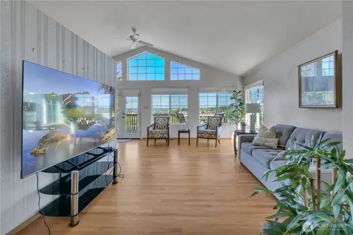 Open feel, tons of natural lighting and the gleaming oak hardwood floors make this home stunning!