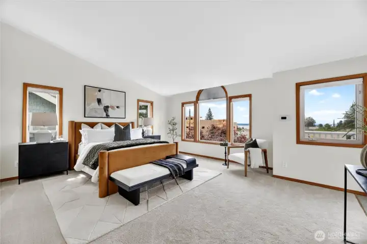 Expansive primary suite with oversized windows, tranquil natural light, and peaceful territorial views creating a true retreat atmosphere.