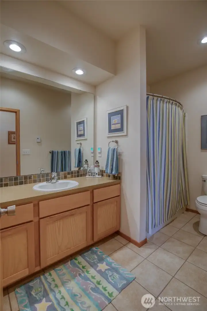 A full bath serves the lower floor.