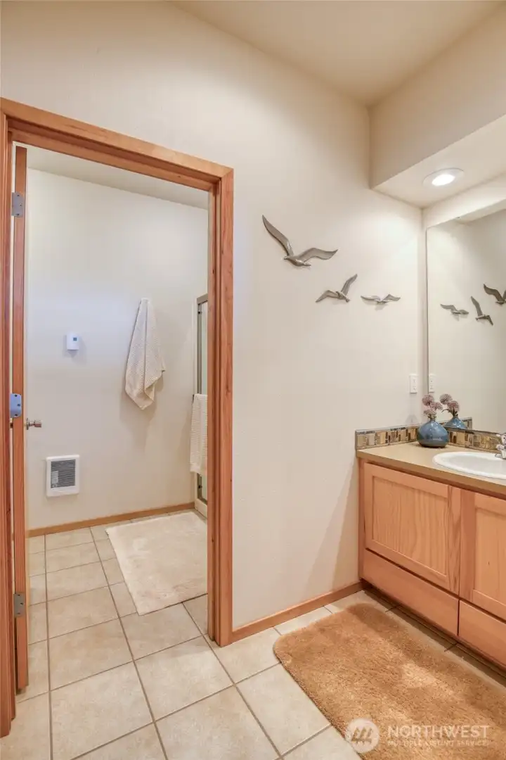 The sink in the primary is separate from the water closet and shower.