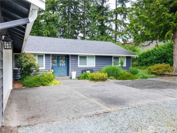 From left to right, Garage, office window, front door, west bedroom, east bedroom