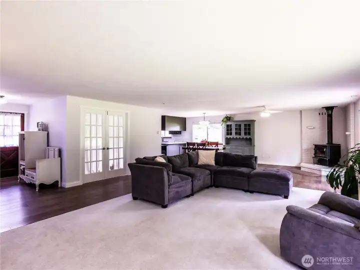 Living room entry way on left, and office with french doors