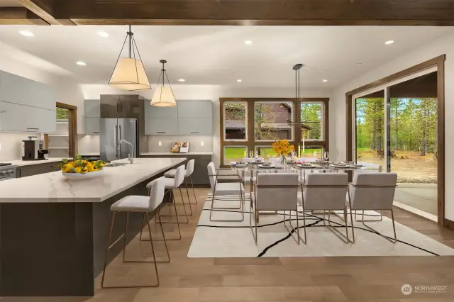 A generous island invites quick bites and opens seamlessly to the formal living space for a flow that is both functional and stylish. Thoughtful finishes and fixtures from the main floor extend into every space.