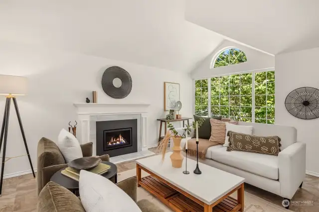 Livingroom features a gas fireplace and an oversized West facing window.