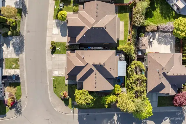aerial view highlighting the lot on this home, you can really get a sense of the tree buffer between the houses, allowing the privacy you would want as you enjoy the backyard area
