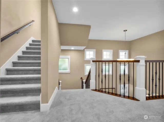 Balcony area overlooking the formal dining room/living room area and stairs leading up to the 3rd level Rec Room.