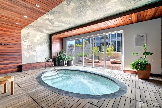 Jacuzzi with private tanning/lounging outdoor area.