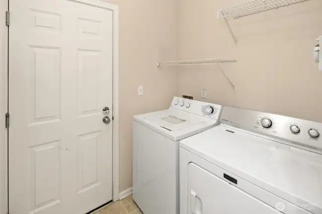 Laundry at garage entrance. Washer & dryer stay.