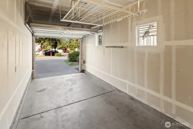 Spaces attached garage. Extra parking space on driveway.