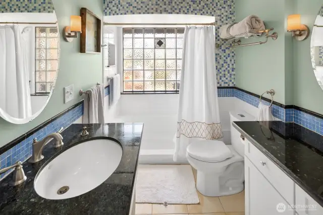 Upstairs bath is flexible and bright.
