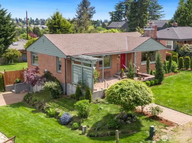 The gorgeous landscaping of this 7200sqft. corner lot creates a variety of spaces to enjoy. The yard has been recently landscaped with Italian Cypress, arborviate, and boxwoods. The roses and rhododendrons are amazing - this yard is just coming into season and will be blooming for months.