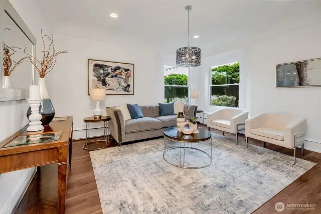 Soaring ceilings and tons of natural light are all part of the living room. Windows are SW facing so wonderful light throughout the day cascades in and drenches you in its embrace!