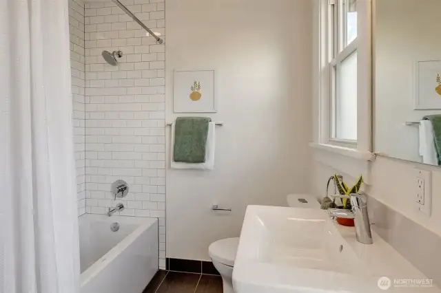 This is the upstairs full bath. Clean and bright with classic finishes.