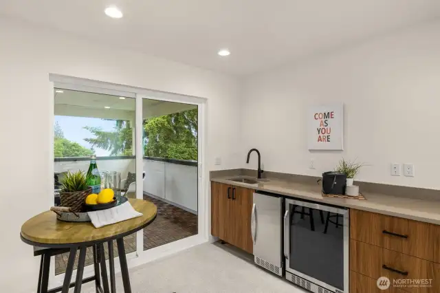sink, icemaker and beverage fridge in the wet bar