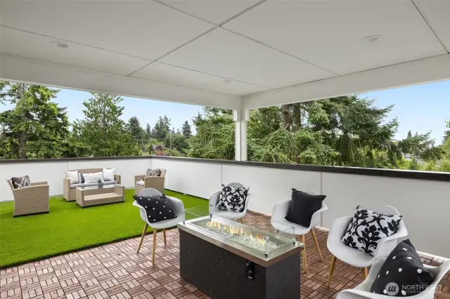 covered deck with gas fireplace (plumbed) included.