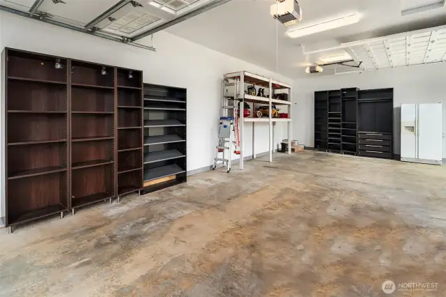 4 car garage with EV charger wiring, a 10x10 RV roller door and a double garage door (wifi enabled)