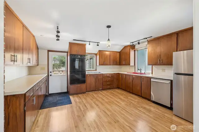 Unit A's spacious kitchen.  Plus this home doesn't have an HOA which means no rules, just pure freedom. This property lets you live life on your terms with none of the restrictions that come with an HOA. And Unit A’s brand-new deck is ready for you to kick back, enjoy the fresh air, and take full advantage of that freedom. Whether you’re entertaining or just lounging in peace, this outdoor space is all yours to enjoy however you want. It is the kind of flexibility that’s hard to come by these days.