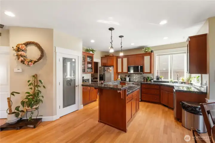 Kitchen with Granite Tile Counters and Stainless Steel Appliances!