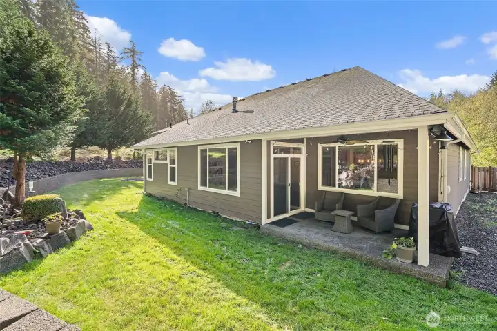 Covered patio out back to enjoy the outdoors in any weather.