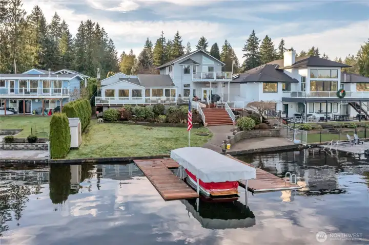 Aerial view highlighting deep-water moorage and exceptional lakefront living