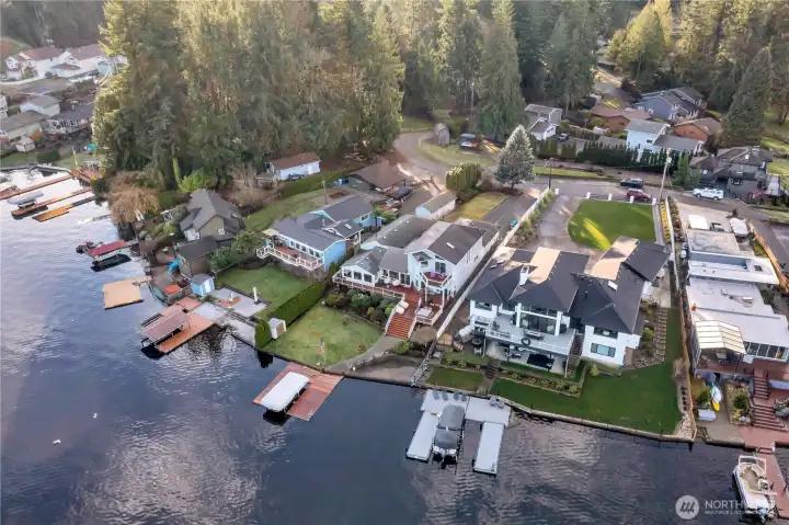 Bird's-eye view of waterfront home with deep-water moorage