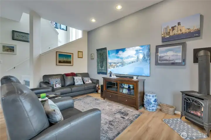 Specious family room with vaulted ceilings, natural light, and flexible living space