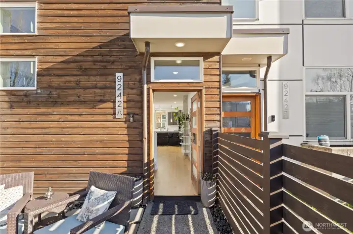 Gated entry leads to welcoming patio space.