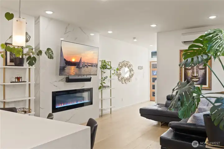 Cozy living space with electric fireplace.