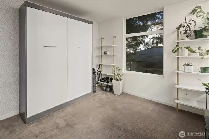 2nd of 2 bedrooms on the 2nd level. Murphy bed stays.