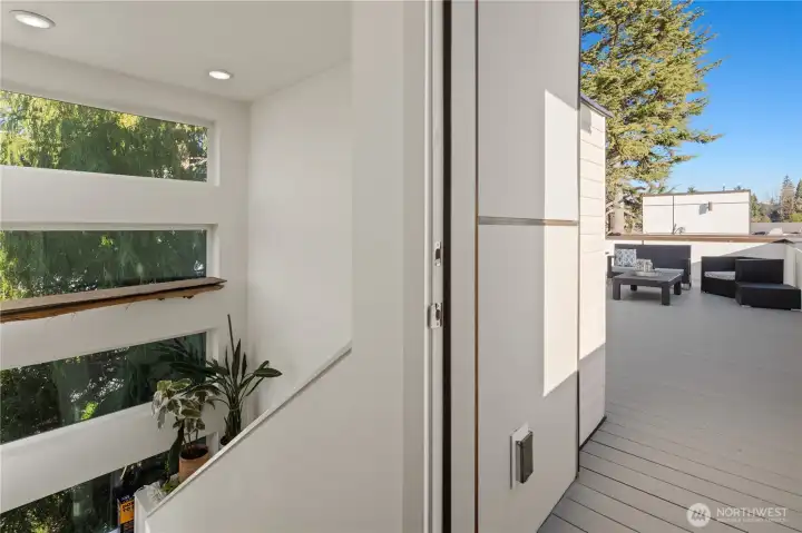 Beautiful light with extra windows leading up to the rooftop deck.