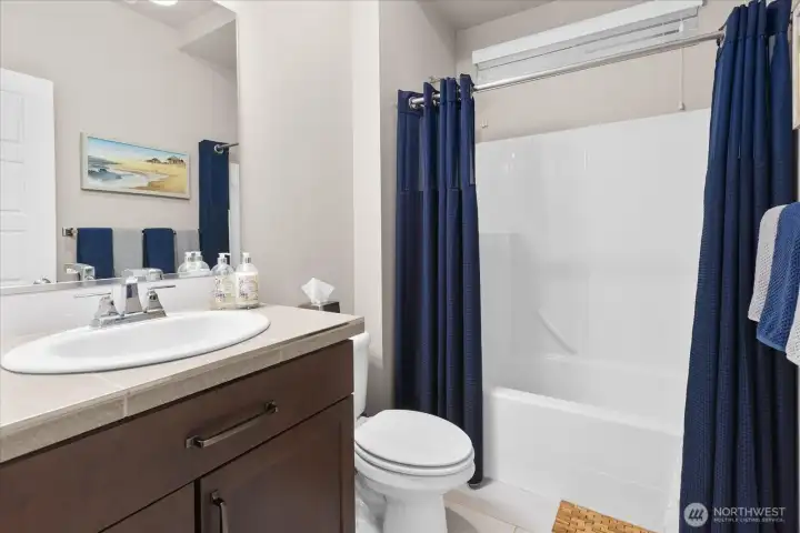 The main floor bathroom features a tub/shower combo