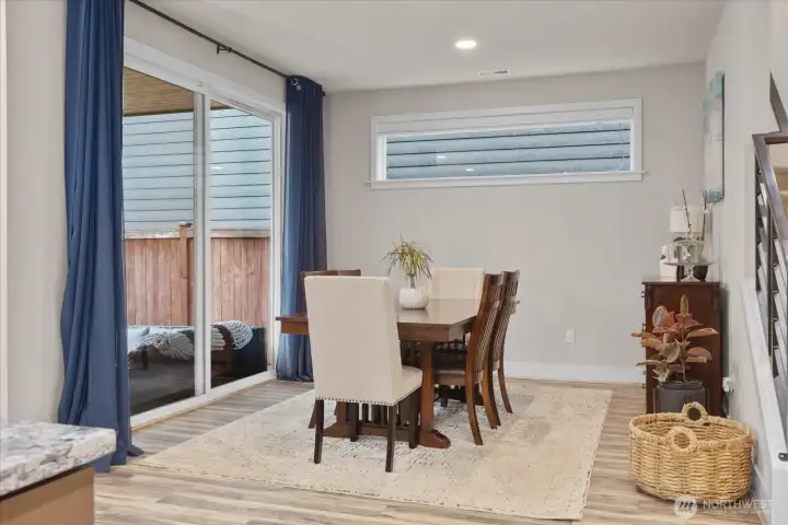 Enjoy hosting large parties or sitting down to a casual meal in this dining room - with great flow onto the outdoor covered patio