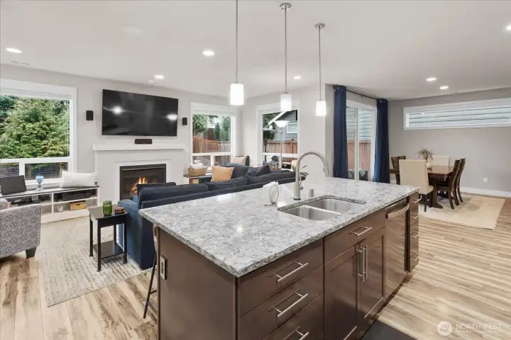 View of the open concept layout and great room space - ideal for entertainment and everyday living! All attached TV's will stay with the home as well.