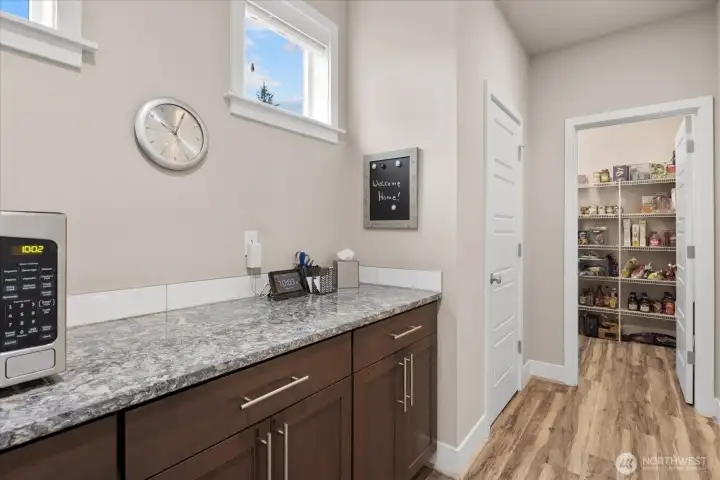 Another view of the butler pantry looking into the walk-in pantry