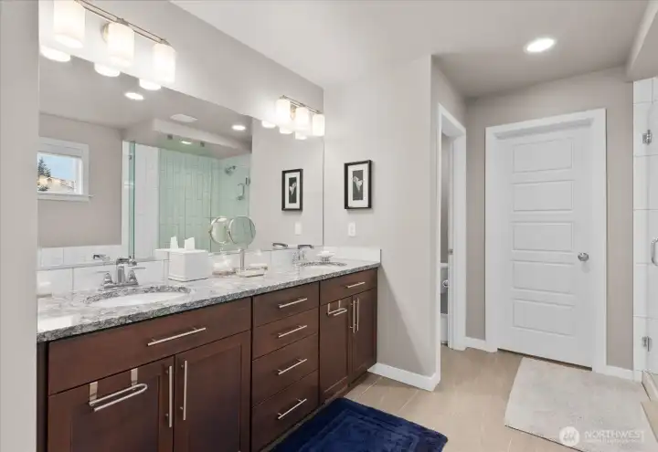 The beautiful wood vanity offers double sinks and provides ample storage.