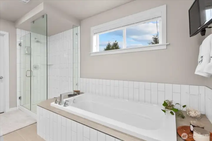 The deep soaking tub and subway tile shower are as stylish as they are relaxing.