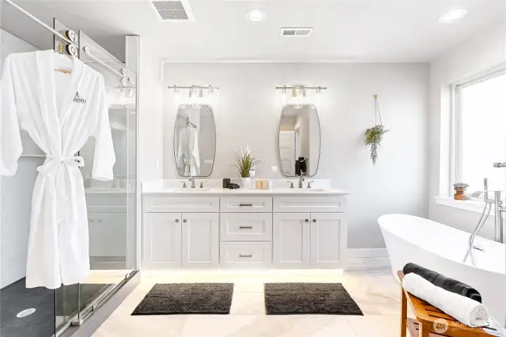 And a separate shower, which is also made up of all one piece solid quartz, with glass shower doors, make this a spa like retreat.