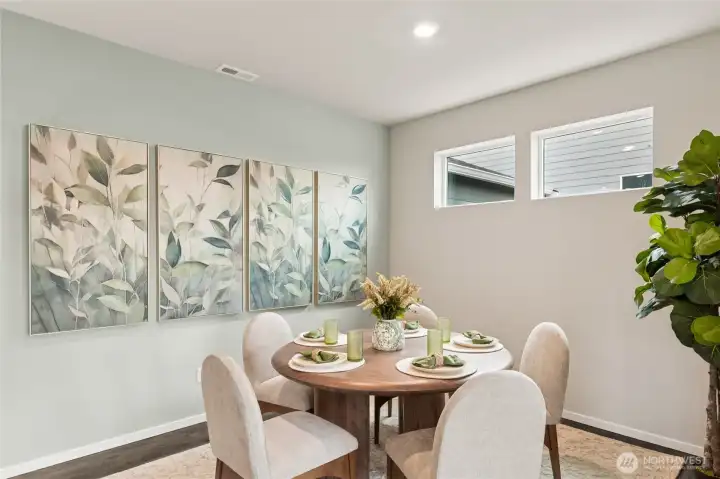 Formal dining space can accommodate 8-person dining table with ease. Photo is representational. Actual home is under construction. Colors, materials, and features may vary. See site agent for details.