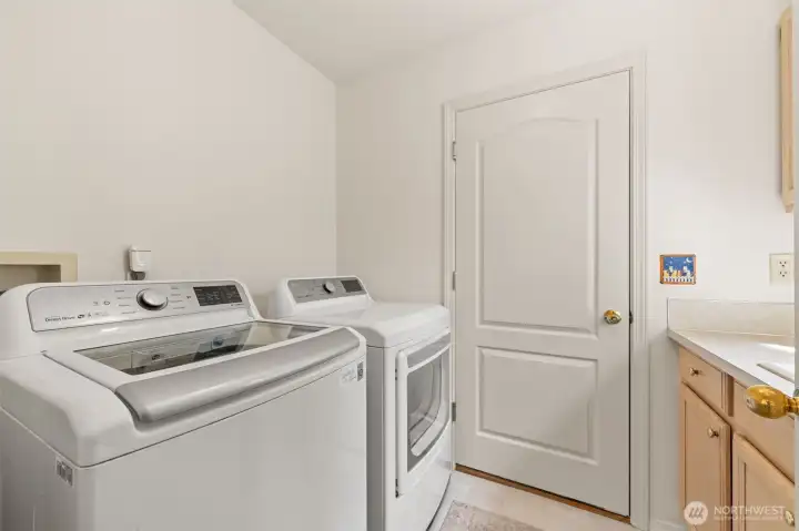 Walk Through Laundry to  3 car garage