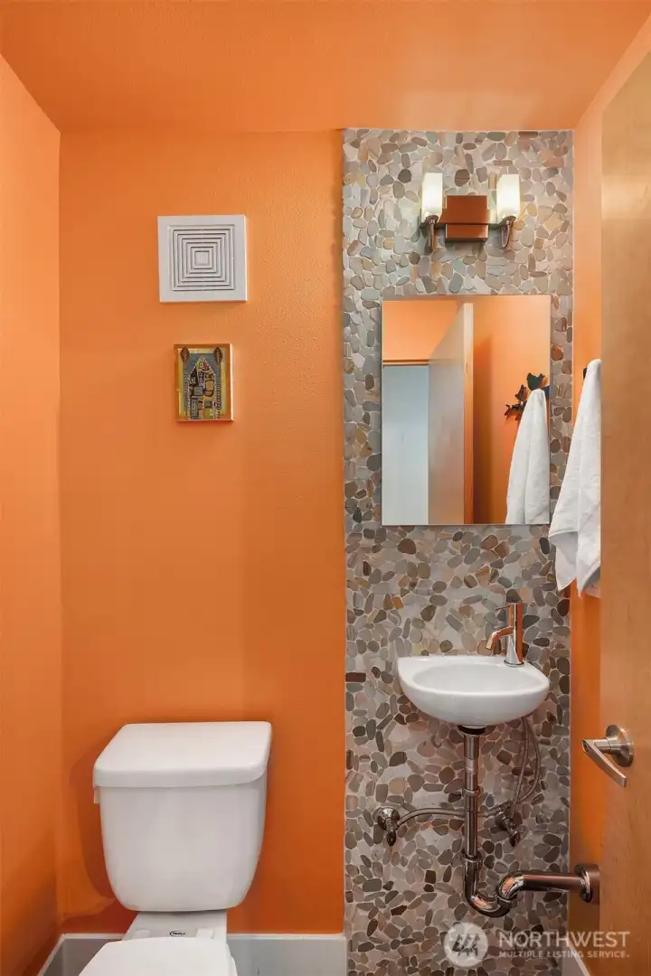 Main flooor powder room off the kitchen, living area.