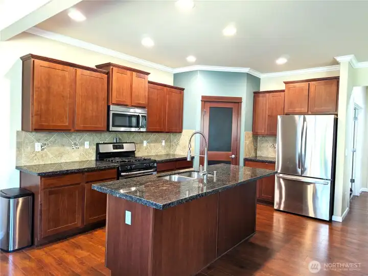 Lots of cabinets for storage and walk in pantry