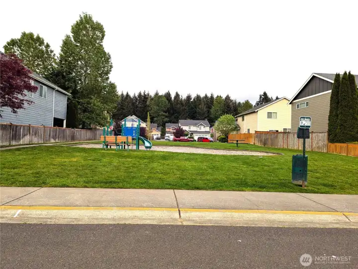 Neighborhood playground with athletic court.