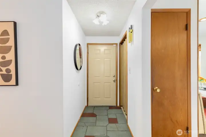 Entryway with coat closet and durable floors for those wet NW days.