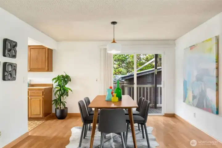 Dining area off kitchen and living with a slider leading to BIG back deck and yard.