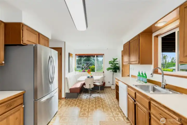 Ample cupboard storage and pantry closet.