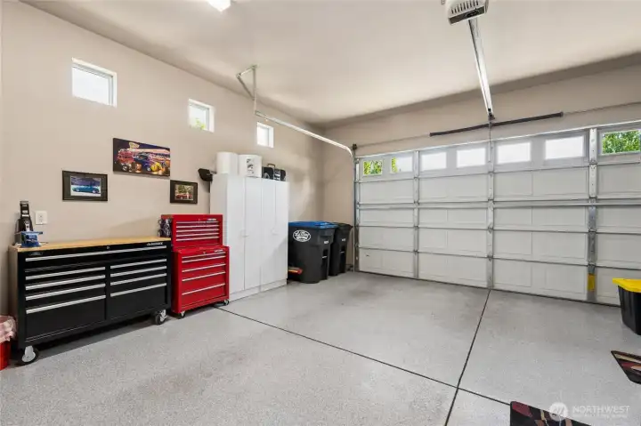 Epoxy garage floor, textured & painted wall make this space look squeaky clean