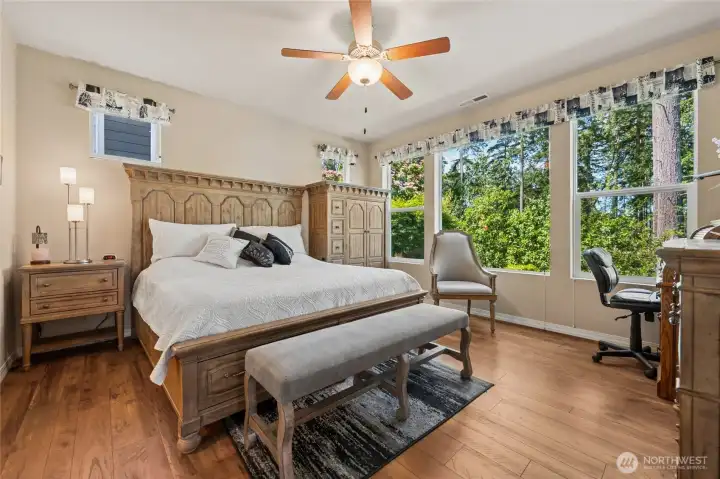Primary Suite at the back of the home with large picture windows