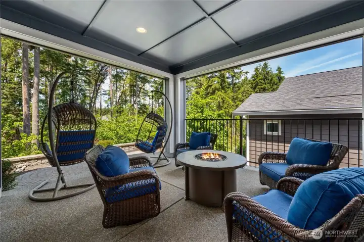 The back covered patio is built for relaxing and entertaining all at the same time